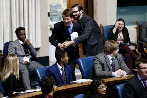 JOHN WOODS / WINNIPEG FREE PRESS
Speaker Joey Broda (left) is "caught" by Premier Ariel Melamedoff as part of the opening ceremonies of the 96th Winter Session of the Youth Parliament of Manitoba at the Manitoba Legislature Tuesday, December 26, 2017.