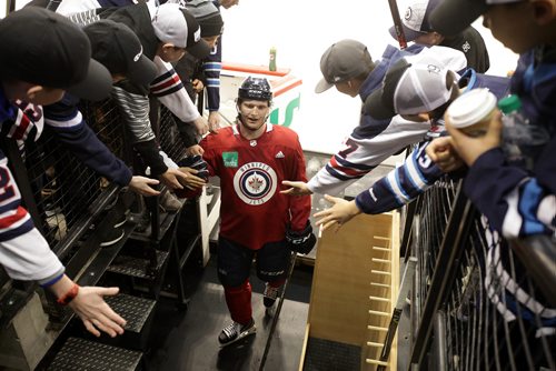 RUTH BONNEVILLE / WINNIPEG FREE PRESS

Winnipeg Jets player Jacob Trouba -  #8, gets high-fived by young players with  the River East (9-11-year-olds) minor hockey team as he leaves the ice after practice Thursday.  One of the parents won the opportunity for 20 people to watch a hockey practice at a Jets Gala in the fall and decided to give it to players on the River East team.
Standup photo 


Dec 28, 2017
