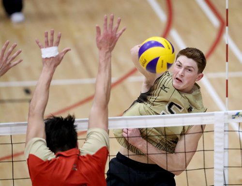 TREVOR HAGAN / WINNIPEG FREE PRESS
University of Manitoba's Scott Vercaigne (5), hits past the Université Laval Rouge Et Or block, during Wesmen Classic volleyball at the Duckworth Centre at the University of Winnipeg, Saturday, December 30, 2017.