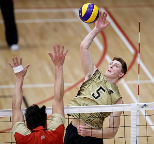 TREVOR HAGAN / WINNIPEG FREE PRESS
University of Manitoba's Scott Vercaigne (5), hits over the Université Laval Rouge Et Or block, during Wesmen Classic volleyball at the Duckworth Centre at the University of Winnipeg, Saturday, December 30, 2017.