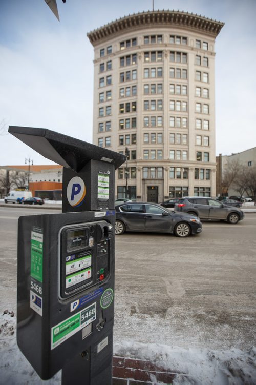 MIKE DEAL / WINNIPEG FREE PRESS
Some parking meters in the Exchange area have new stickers on them explaining the hourly rates. The two free hours on Saturday stickers are still there as well.
180102 - Tuesday, January 02, 2018.