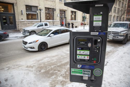 MIKE DEAL / WINNIPEG FREE PRESS
Some parking meters in the Exchange area have new stickers on them explaining the hourly rates. The two free hours on Saturday stickers are still there as well.
180102 - Tuesday, January 02, 2018.