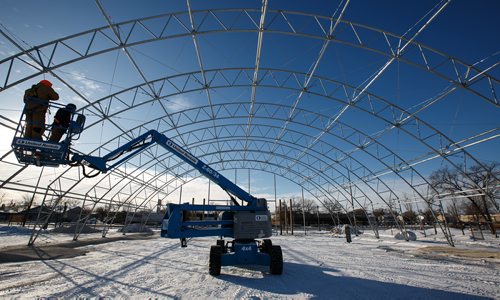 MIKE DEAL / WINNIPEG FREE PRESS
Jared Desmottes and Jeff Andrews work in -24C weather installing the framework for the new canopy for the St. Norbert Farmers Market.
180103 - Wednesday, January 03, 2018.