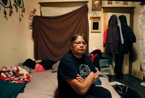 PHIL HOSSACK / WINNIPEG FREE PRESS - Eleanor Sinclair sits in the North End home of her parents Wednesday evening. Her daughter Windy Gayle Sinclair froze to death over the weekend after leaving the hospital being treated for Crystal Meth OD. Gayle's daughter, Eleanor's grandaughter, slleps on a mattress in the tiny house. See story.   January 3, 2018