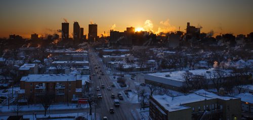 MIKE DEAL / WINNIPEG FREE PRESS
The sun rises over downtown Winnipeg as seen from the new Manitoba Clinic building.
180104 - Thursday, January 04, 2018.