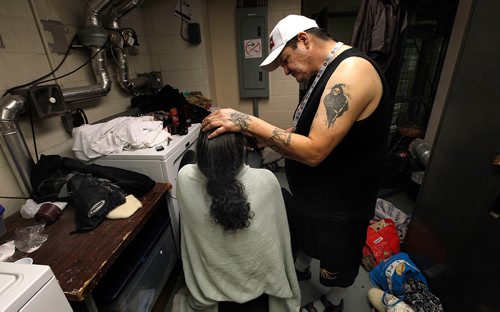 PHIL HOSSACK / Winnipeg Free Press -  "Double D" aka Dominic Vincent shaves a beard off of Rob Nicholas' face Thursday evening in the laundry room at the Winnipeg Project's rehab division. See Jen Zorati's story. -   January 4, 2018