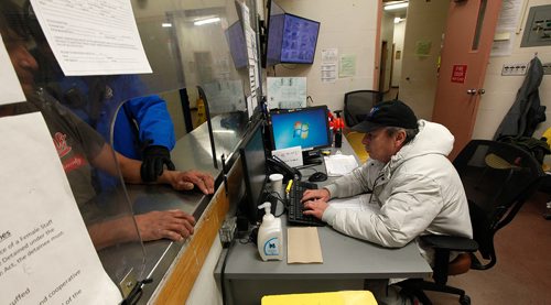 PHIL HOSSACK / Winnipeg Free Press -  George (last name with held) checks in an intoxicated man brought in by Police Cadets Thursday evening at the Winnipeg Project's shelter. See Jen Zorati's story. -   January 4, 2018