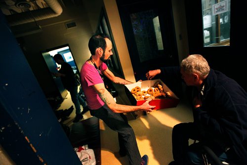 PHIL HOSSACK / Winnipeg Free Press -  Ian (last name with held) walks through sleeping homeless Thursday evening at the Winnipeg Project's shelter offering doughnuts after a late night visitor left a large boxful for the shelter. See Jen Zorati's story. -   January 4, 2018