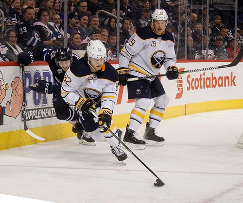 PHIL HOSSACK / Winnipeg Free Press -   Buffalo Sabre #82 Nathan Beaulieu breaks away from Winnipeg Jet #81 Kyle Connor in the second period Thursday at Bell MTS Place as the Sabres took on the Winnipeg Jets. Sabres #19 Jake McKabe follows up. - January 5, 2018