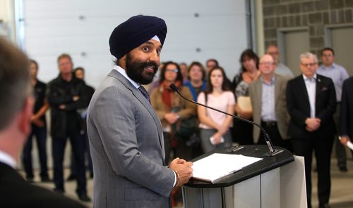 PHIL HOSSACK / Winnipeg Free Press -  Navdeep Bains, federal Minister of Innovation, Science and Economic Development and Minister responsible for Western Economic Diversification is announcing more than $6 million in funding for a handful of economic development agencies in Winnipeg. Here's he's introduced to the auience of about 50 at the composites Innovation Centre by the Honorable Jim Carr. - January 8, 2018