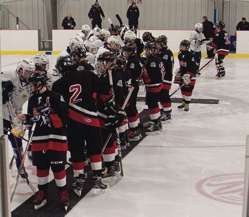 Canstar Community News Jan. 2, 2018 - Players from the Winnipeg East Railcats bantam AA team exchanged gifts with players from Tullinge, Sweden, who were in Winnipeg on an exhibition tour. Tullinge won their game against the Railcats 7-4. (SHELDON BIRNIE/CANSTAR/THE HERALD)