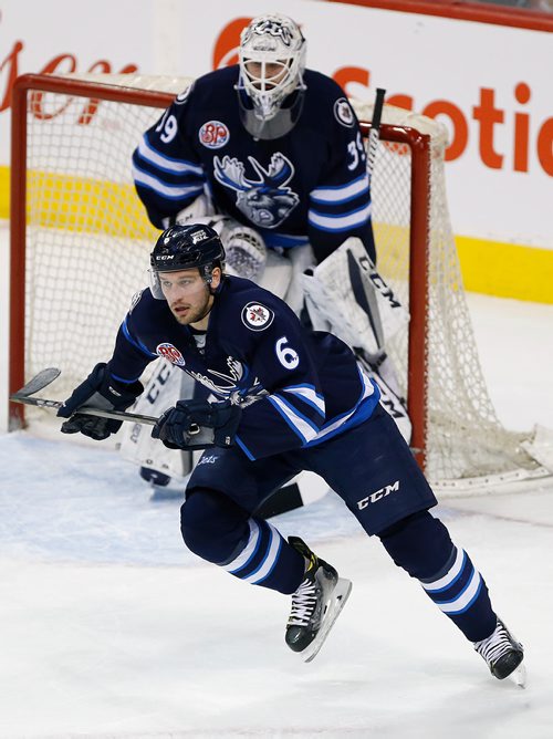 JOHN WOODS / WINNIPEG FREE PRESS
Manitoba Moose Tucker Poolman (6) was in the lineup against the Grand Rapids Griffins' Matthew Ford (55) during first period AHL action in Winnipeg on Monday, January 8, 2018.