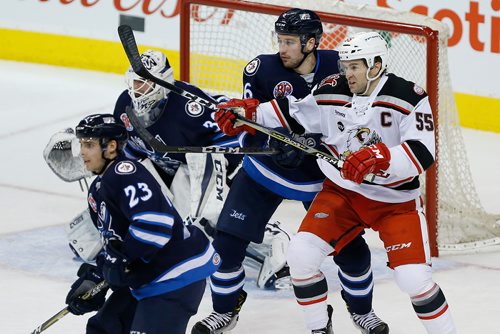 JOHN WOODS / WINNIPEG FREE PRESS
Manitoba Moose Tucker Poolman (6) attempts to move Grand Rapids Griffins' Matthew Ford (55) during first period AHL action in Winnipeg on Monday, January 8, 2018.