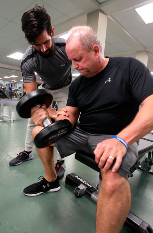 BORIS MINKEVICH / WINNIPEG FREE PRESS
Story on Richard White. He suffered a heart attack at age 50 and now goes the Reh-Fit Centre almost every day. He's part of a larger subculture there of non-gym-rat folks who go at six am several days a week. Photo taken at the Reh-Fit Centre with his personal trainer Clovis Baptista, left. Joel Schlesinger story. January 9, 2018