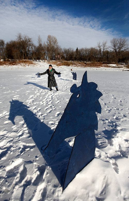 PHIL HOSSACK / Winnipeg Free Press -  Jordan Van Sewel poses on the Red River with a set of horse head silouettes he's installed on the ice. See Doug Spiers story.  - January 9, 2018