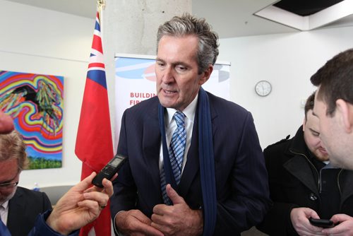 RUTH BONNEVILLE / WINNIPEG FREE PRESS

Brian Pallister, Premier of Manitoba with media after news conference announcing funding by the governments for high-speed Internet infrastructure in the north at the Millennium Library Tuesday morning. 


Jan 09, 2018

