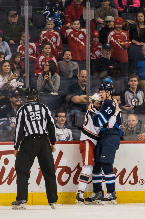 DAVID LIPNOWSKI / WINNIPEG FREE PRESS

Manitoba Moose Buddy Robinson (#10) fight hugs with Grand Rapids Griffins Dominik Shine (#65) during first period action at Bell MTS Place Wednesday January 10, 2018.
