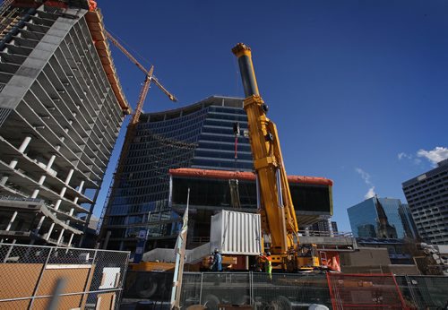 RUTH BONNEVILLE / WINNIPEG FREE PRESS

Construction crews slowly dismantle a large, all-terrain crane that was being used to help build Truth North Square Saturday. 
Standup 
Jan 13, 2018
