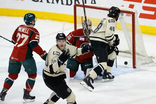 JOHN WOODS / WINNIPEG FREE PRESS
Manitoba Moose Buddy Robinson (10) celebrates as Peter Stoykewych's (42) shot from the point gets past Iowa Wild's Niklas Svedberg (35) during first period AHL action in Winnipeg on Sunday, January 14, 2018.