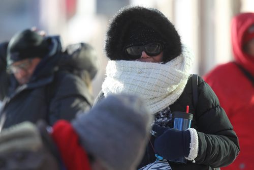 RUTH BONNEVILLE / WINNIPEG FREE PRESS

People cope with extremely cold wind chills on Portage Ave in downtown Winnipeg Monday. 
Weather story.  
Jan 15, 2018
