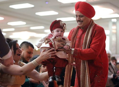 JASON HALSTEAD / WINNIPEG FREE PRESS

Paul Dhillon introduces hs grandson and Lhori baby, four-month-old Juliano Dhillon, to Sharon Tappia of Asian Women of Winnipeg at Lohri Mela 2018 at the RBC Convention Centre Winnipeg on Jan. 13, 2018. (See Social Page)