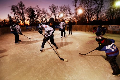 JOHN WOODS / WINNIPEG FREE PRESS
Chase De Leo (9) and other Moose players play hockey on the Azaransky family rink in West St. Paul Tuesday, January 16, 2018. The players joined the Azaransky family, winners of the Backyard Rink Contest, and members of their community for an evening of fun and skating on the rink