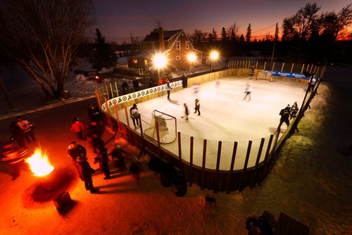 JOHN WOODS / WINNIPEG FREE PRESS
Moose players play hockey on the Azaransky family rink in West St. Paul Tuesday, January 16, 2018. The players joined the Azaransky family, winners of the Backyard Rink Contest, and members of their community for an evening of fun and skating on the rink