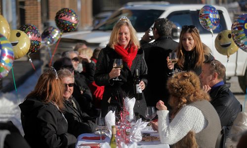 PHIL HOSSACK / Winnipeg Free Press - Patrons enjoy a warm sun and a lil wine Wednesday afternoon at the 34th annual Polar Bear Lunch hosted by Arnaldo Carreira in front of his restaurant at 2015 Portage ave. (Gus and Tony's). -  January 17, 2018