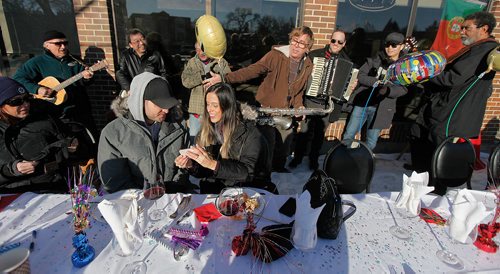 PHIL HOSSACK / Winnipeg Free Press - Edgar Paulo and Erica Neves share a selfie while enjoying an impromptu serenade Wednesday afternoon at the 34th annual Polar Bear Lunch hosted by Arnaldo Carreira in front of his restaurant at 2015 Portage ave. (Gus and Tony's). -  January 17, 2018