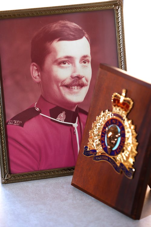 JOHN WOODS / WINNIPEG FREE PRESS
Photographs and a memorial plague of RCMP officer Dennis Onofrey, who was shot to death in Virden 40 tears ago, sits on the window sill in the home his mother Rose Onofrey Tuesday, January 16, 2018. Dennis Onofrey was killed January 23, 1978 during a standoff in Virden, Manitoba. He was 27.