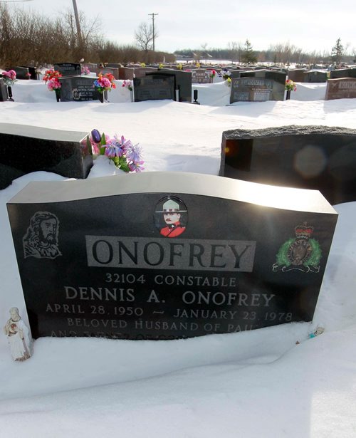 BORIS MINKEVICH / WINNIPEG FREE PRESS
Const. Dennis Onofrey is buried in the Assumption Roman Catholic Cemetery on the west end of the city. The grave marker has a photo of Onofrey, an etching of the RCMP regimental badge with another of Jesus, and his dates of birth and death. Here is the head stone. January 19, 2018
