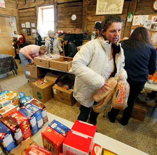 PHIL HOSSACK / Winnipeg Free Press - Angie Guiboche stocks up on essentials at the Euclid Ave Food Bank at Barber House Friday. See Nick Martin story re: Funding Cuts. -  January 19, 2018