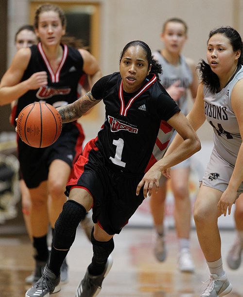 PHIL HOSSACK / Winnipeg Free Press -  U of W #1 Antoinette Miller leads the charge agaisnt the U of M Bisons Friday at Investor's Group Athletic Centre. -  January 19, 2018