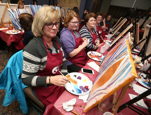 L-R: Beate Janssen, Julie Stewart and Cheryl Jones take part in Urban Stable's paint party fundraiser on Jan. 18, 2018 at Triple B's Bar and Billiards on Scurfield Boulevard. (See Social Page)