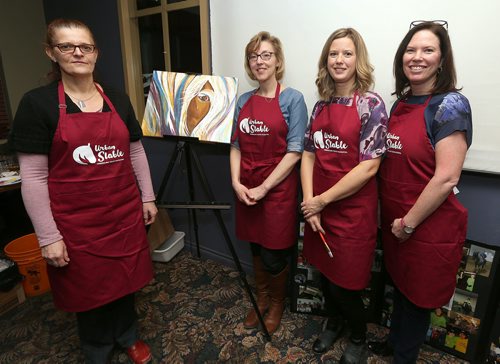 L-R: Michelle Gooding (past board member), Judy Recksiedler (past board member), Lana Stevenson (board member) and Shannon MacLaren (past board member) at Urban Stable's paint party fundraiser on Jan. 18, 2018 at Triple B's Bar and Billiards on Scurfield Boulevard. (See Social Page)