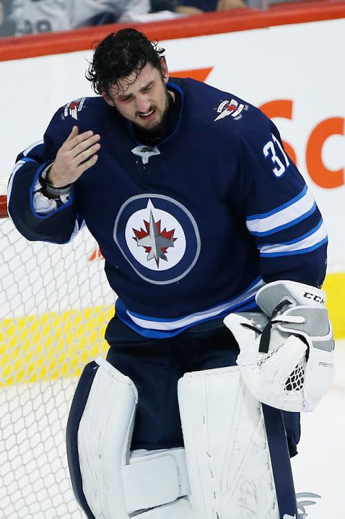JOHN WOODS / WINNIPEG FREE PRESS
Winnipeg Jets goaltender Connor Hellebuyck (37) heads to the bench after getting a stick in the eye during third period NHL action in Winnipeg on Sunday, January 21, 2018.