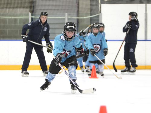 RUTH BONNEVILLE / WINNIPEG FREE PRESS

Kids from Donwood Elementary School,  grades 2-3, skate at practice on ice at Gateway Recreation Centre as part of the Winnipeg Jets Hockey Academy, a program of the True North Youth Foundation Monday. 
Cameron learns to skate around pylons as her classmates and coaches  stand behind her Monday. 
Standup photo 
Jan 19, 2018
