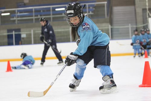 RUTH BONNEVILLE / WINNIPEG FREE PRESS

Kids from Donwood Elementary School,  grades 2-3, skate at practice on ice at Gateway Recreation Centre as part of the Winnipeg Jets Hockey Academy, a program of the True North Youth Foundation Monday. 
Hailey learns to skate around pylons as her classmates and coaches  stand behind her Monday. 
Standup photo 
Jan 19, 2018
