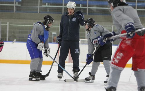 RUTH BONNEVILLE / WINNIPEG FREE PRESS

Kids face off during practice on ice at Gateway Recreation Centre as part of the Winnipeg Jets Hockey Academy, a program of the True North Youth Foundation. This group of Grades 6 and 7 students from Chief Peguis Junior Hight has been adopted by Price Industries through the WJHA's Living Philanthropy Program. 
Cale David an instructor from Price Industries drops the puck for scrimmage game during practice.  

Standup photo 
Jan 19, 2018

