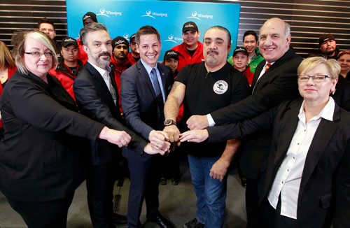 BORIS MINKEVICH / WINNIPEG FREE PRESS
Mayor Bowman announced new funding to support downtown foot patrols, Bear Clan Patrol and Take Pride Winnipeg at Portage Place Mall. From left, Diana Wiesenthal, Downtown Winnipeg BIZ, David Pensato, Exchange District BIZ, Mayor Brian Bowman, James Favel, Bear Clan Patrol, Tom Ethans, Take Pride Winnipeg, and Gloria Cardwell-Hoeppner, West End BIZ.  January 23, 2018