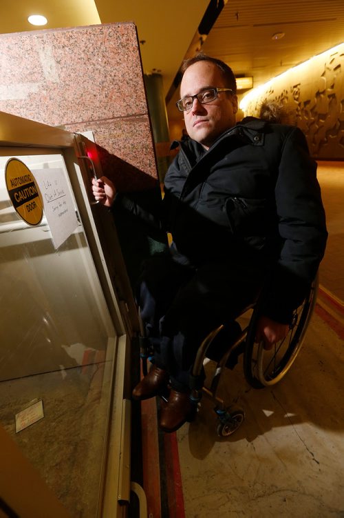 JOHN WOODS / WINNIPEG FREE PRESS
Allen Mankewich is bringing attention to an out of order elevator in in the course under Portage and Main in Winnipeg Tuesday, January 23, 2018. The elevator has been broken for a week and means some people with disabilities can't cross the stairs.