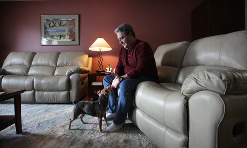 RUTH BONNEVILLE / WINNIPEG FREE PRESS

Feature:  Lewy Body dementia 
Photos at home of Sandy and her husband Doug McLean , 61, who has Lewy Body dementia (first noticed changes in his mid-50s). They are still living together and use home care services. 
Photo of Doug in a quiet moment with his dog.

See Carol Sanders  | Reporter 

Jan 23, 2018
