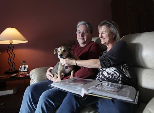 RUTH BONNEVILLE / WINNIPEG FREE PRESS

Feature:  Lewy Body dementia 
Photos at home of Sandy and her husband Doug McLean , 61, who has Lewy Body dementia (first noticed changes in his mid-50s). They are still living together and use home care services. 
Doug and Sandy share a happy moment on the couch at home with their dog.  
See Carol Sanders  | Reporter 

Jan 23, 2018
