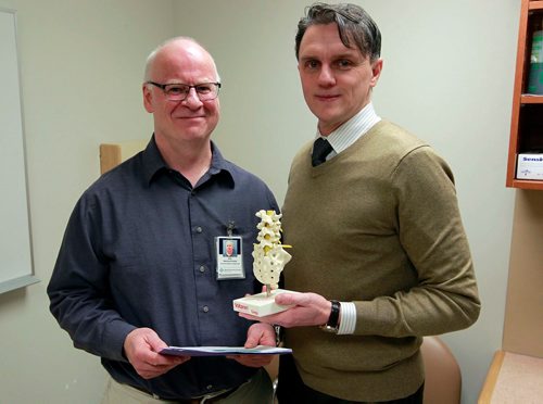 BORIS MINKEVICH / WINNIPEG FREE PRESS
Manitoba's Spine Clinic at HSC. From left, Neil MacHutchon (dir. of physiotherapy HSC/WRHA) and Dr. Michael Johnson (spine surgeon). They pose for a photo in one of the two rooms they use to check out patients at HSC. Jane Gerster story. January 24, 2018