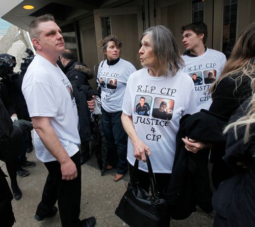 PHIL HOSSACK / WINNIPEG FREE PRESS - Left to right, Cooper Nemeth's Father Brent, mother Gaylene and Grandmother Janet Rathwell show the strain as they exit the courthouse post sentencing in their son's murder Wednesday. An unidentified supporter left, wears a t-shirt in memory of Cooper. See Katie-May's story.  -  January 24, 2018