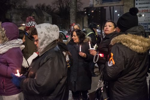 Daniel Crump / Winnipeg Free Press. Attendees of the vigil for Claudette Osborne-Tyo light candles and take a moment to remember all of Canada's missing and murdered indigenous women. January 24, 2018.