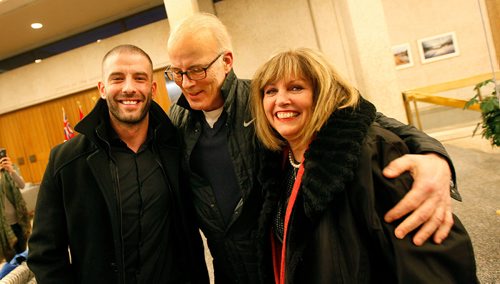 PHIL HOSSACK / Winnipeg Free Press - Left to right - Darcy Oake and his parents Scott and Anne celebrate after a city council vote approving the recovery centre at the Vimy Arena site Thursday.   -  January 25, 2018