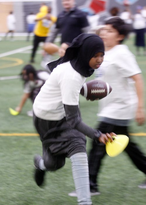 PHIL HOSSACK / Winnipeg Free Press - STAND-UP - 10 yr old Bushra Abtidoon a Dufferin School student, runs a pattern after catching the ball at an afterschool football camp held at the U of W Thursday afternoon. Sponsored by city police and the Blue Bombers about 200 kids assembled Winnipeg Axworthy Health and RecPlex.  See release. -  January 25, 2018

WINNIPEG, MB., January 25, 2018  The Winnipeg Blue Bombers and the Winnipeg Police Association (in partnership with the University of Winnipeg, Sport Manitoba, Canadian Tire Jumpstart Charities, and Spence Neighbourhood Association), will kick-off the 2018 Winnipeg Youth Football Club, an after-school flag football program for youth in downtown Winnipeg.

Each week, more than 200 youth from 10 different schools and organizations in Winnipegs central area will receive free certified flag football coaching for 90 minutes, dinner, t-shirts, and school bus transportation to and from the club, which takes place at the University of Winnipeg Axworthy Health & Recplex.

To celebrate the first week of the camp, Winnipeg Blue Bombers offensive lineman Matthias Goossen and linebacker Thomas Miles will guest coach and will be mentors to the participants.

The Blue Bombers are committed to supporting flag and tackle football at all levels, said Wade Miller, President & CEO of the Winnipeg Blue Bombers. Were proud to work with our partners to provide youth with a safe and fun after-school program where they can learn flag football fundamentals and stay active.

This is the fifth year of the program and the second year the Winnipeg Police Association (WPA) has been the presenting partner.

Both the Winnipeg Police Association and the Winnipeg Blue Bombers have long, successful histories supporting youth in the community, said Maurice Sabourin, President, WPA. The WPA is proud to be the presenting sponsor of the Winnipeg Youth Football Club and we look forward to continuing to connect and work with inne