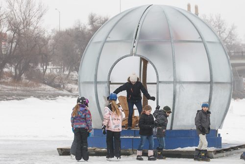 MIKE DEAL / WINNIPEG FREE PRESS
Kids check out one of last years warming huts titled "Greetings From Bubble Beach" while skating on the Red River at The Forks. 
180126 - Friday, January 26, 2018.