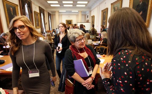 PHIL HOSSACK / Winnipeg Free Press - In a room full of portraits of men, Judy Wasylycia-Leis mingles with participants in the Equal Voice Boot Camp at the Legislature Saturday. Alex Paul's story.  -  January 27, 2018